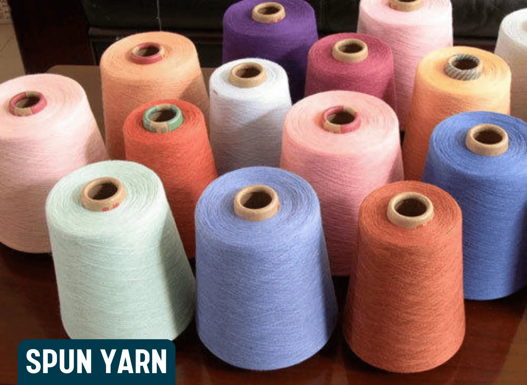 Sustainable spun yarn made from recycled polyester fiber, ensuring durability and softness for textile applications.