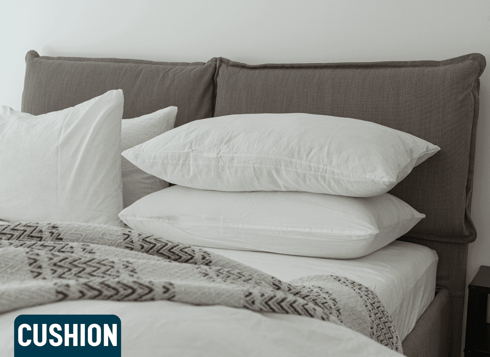 Decorative Cushion: "A decorative cushion with a geometric pattern in vibrant colors, placed on a sofa in a modern living room setting." Cushion on a Bed: "A soft, plush cushion resting on a neatly made bed, adding comfort and style to the bedroom decor." Cushion with Floral Design: "A cushion featuring a colorful floral design, placed on an armchair. The cushion's fabric is soft to the touch and adds a fresh, natural vibe to the room." Throw Cushion Set: "A set of throw cushions in various sizes and colors, arranged neatly on a couch. The cushions add texture and warmth to the living space."